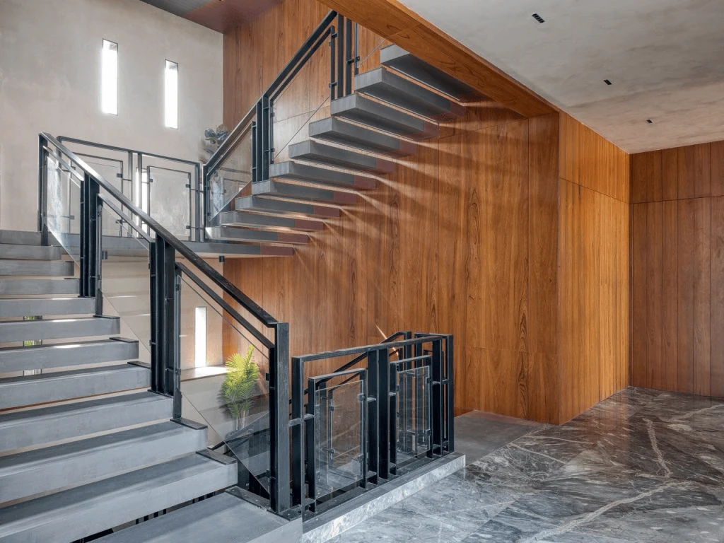 modern stair railing in black metal and glass for a sharp contemporary look