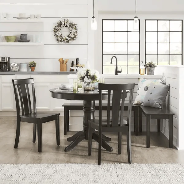 black breakfast nook set with a round pedestal table
