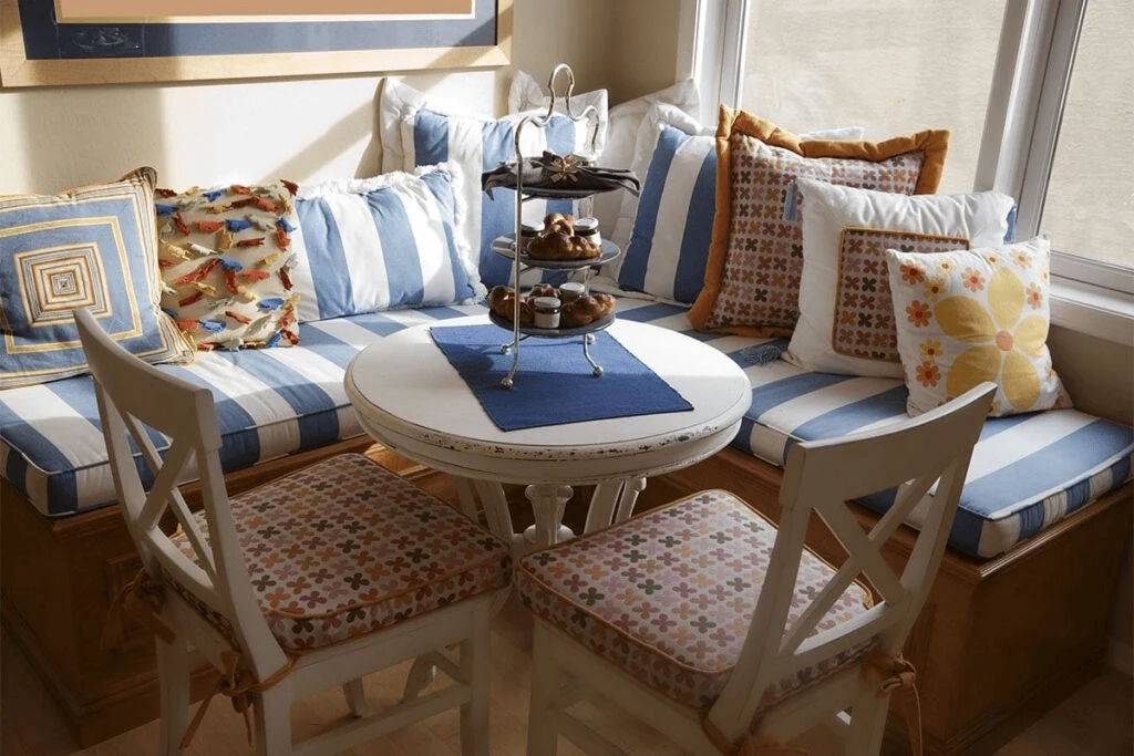 cosy breakfast nook with layered cushion
