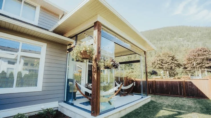 sunroom ideas on a budget with a glass porch and hammock seating