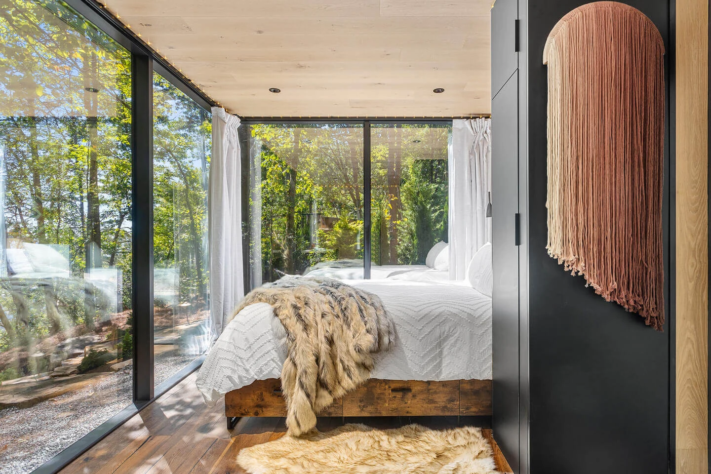 use glass and mirrors to blend the cabin with the view