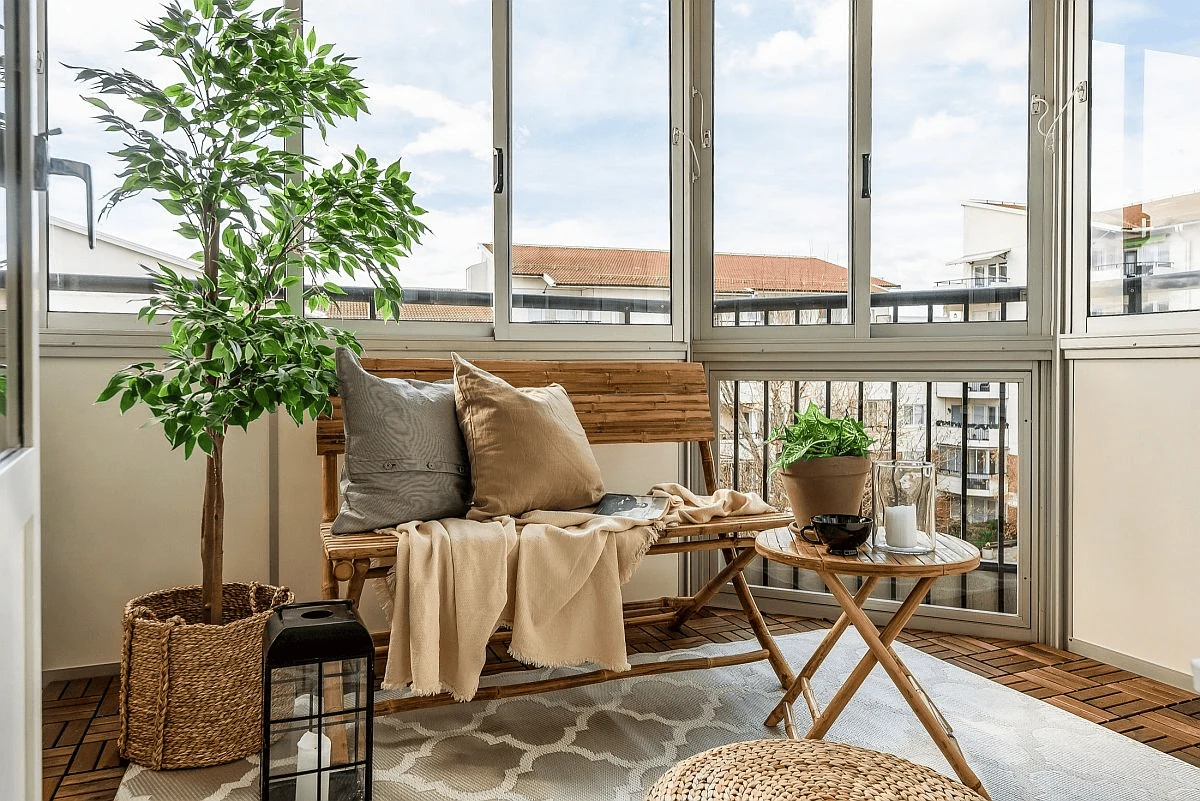 small sunroom ideas for a compact apartment glass nook with a window bench