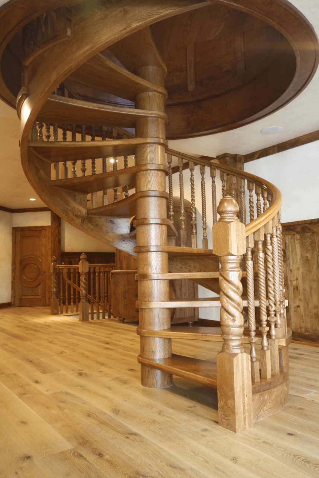 curved timber stair handrail following a softer staircase shape