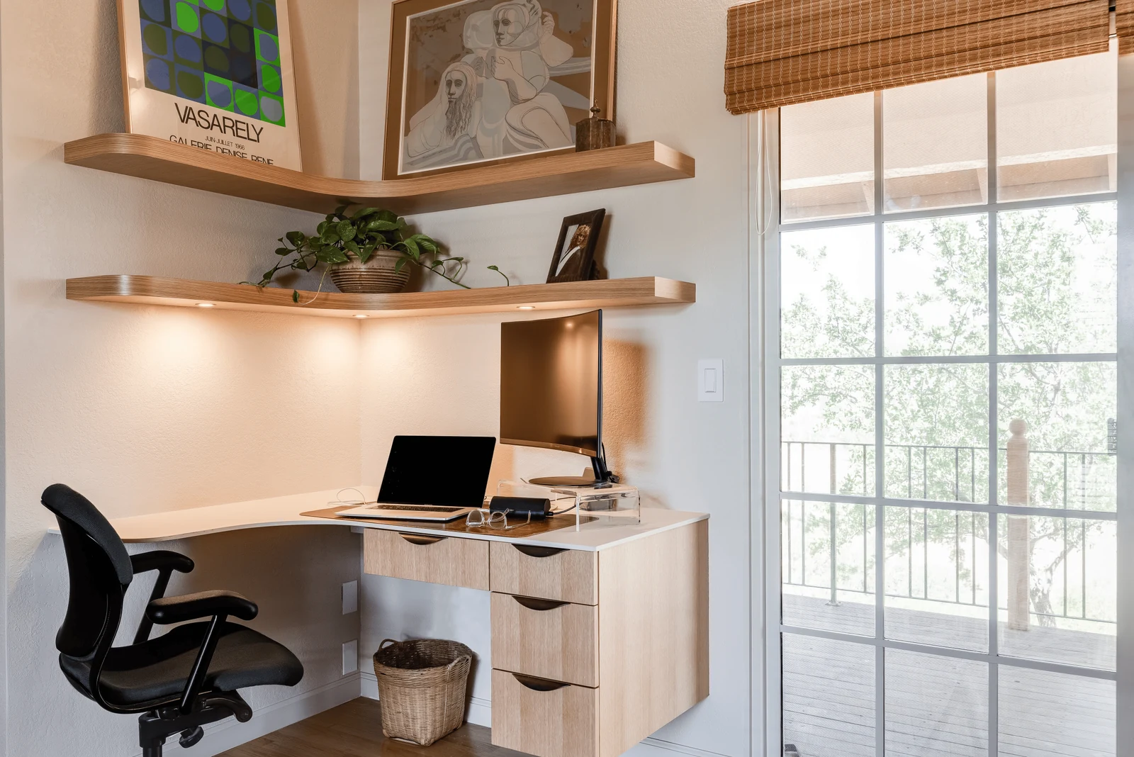 dorm room shelves floating above the study desk for books and stationery