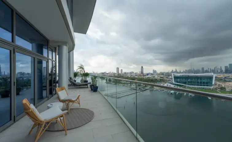 balcony with lounge chairs overlooking the water