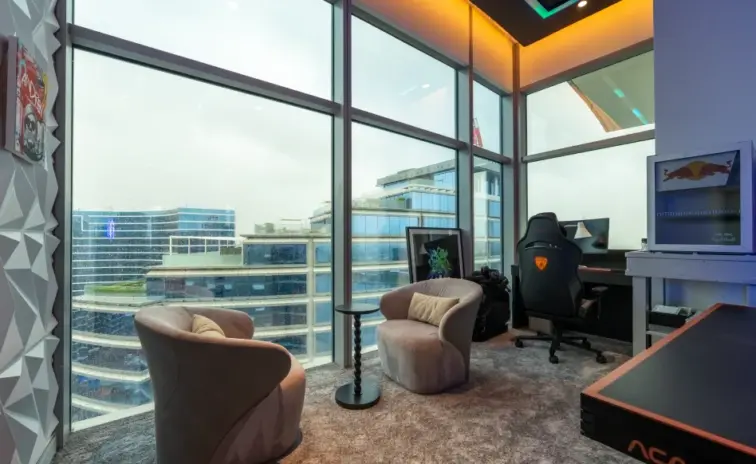 corner gaming desk with a city view