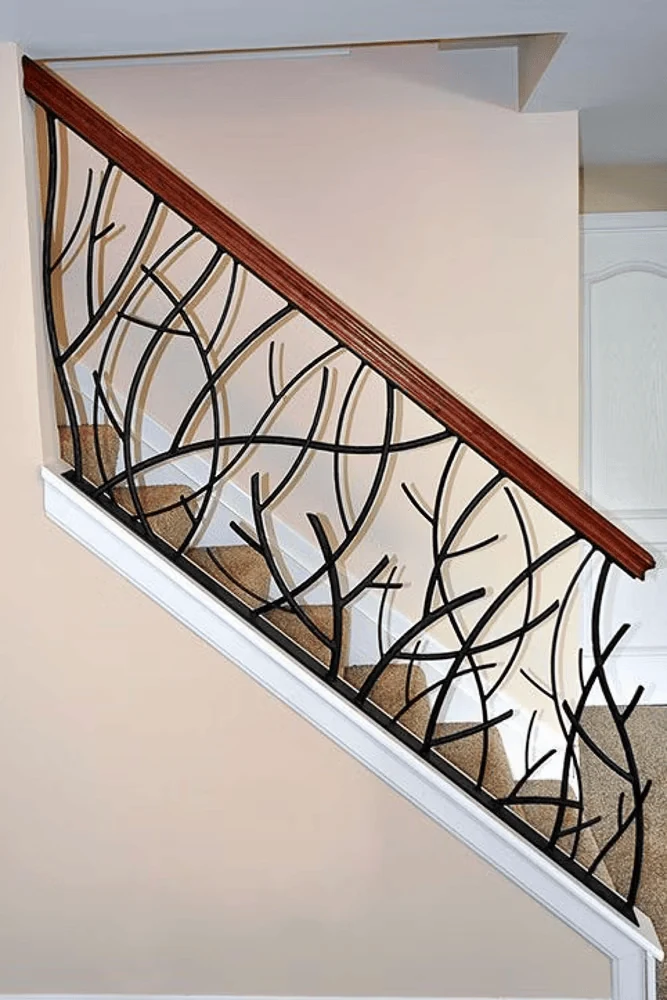 geometric metal stair railing pattern for a designed staircase