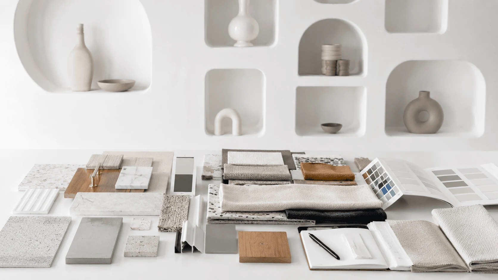 Interior design mood board with fabric, tile, and wood samples.