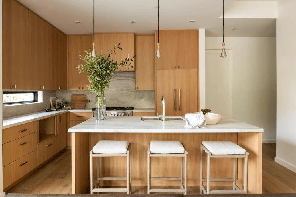 Japandi Kitchen Design in open kitchen layout featuring hidden hood vents