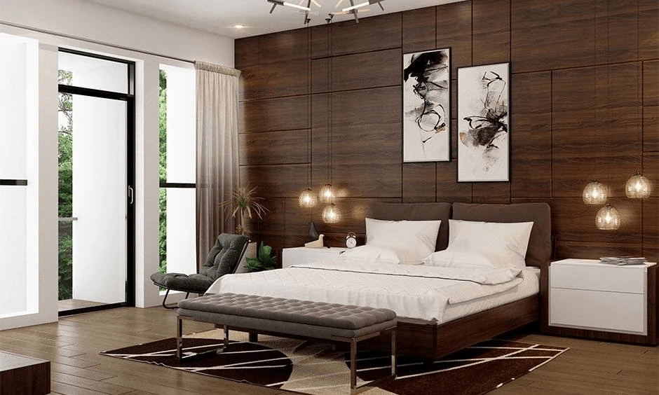 dark moody bedroom with low slung pendants framing the bed