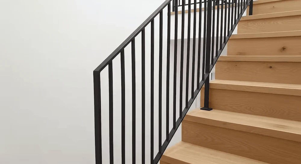 matte black vertical metal stair rails for a clean bold finish