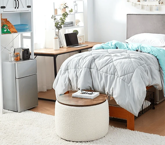 dorm room space saving ideas with a storage ottoman used as seating