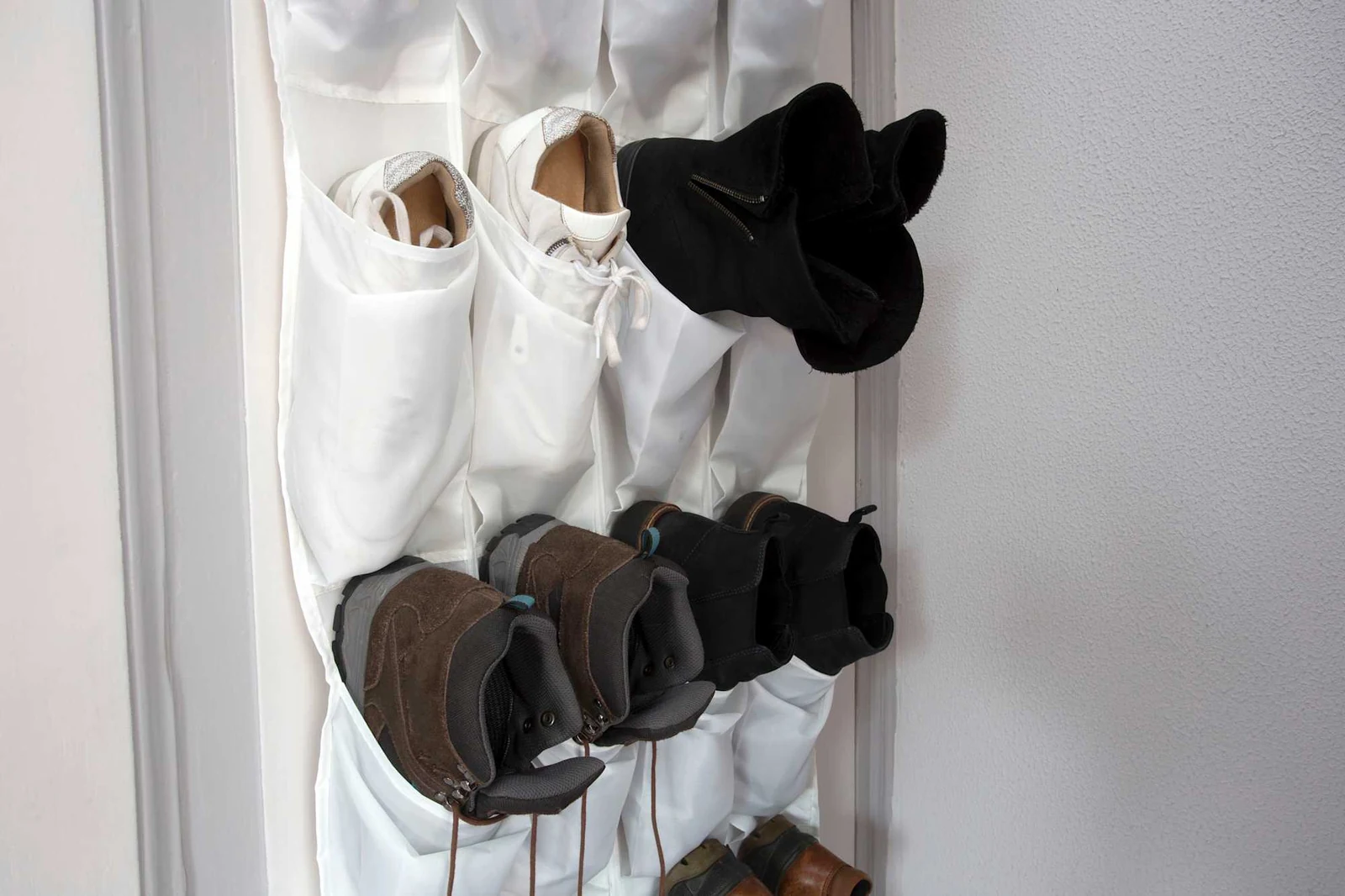 dorm room storage using over door pockets for shoes and small items