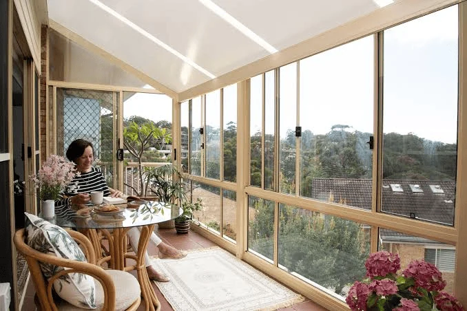 sunroom ideas for a panoramic sun porch with a tea corner