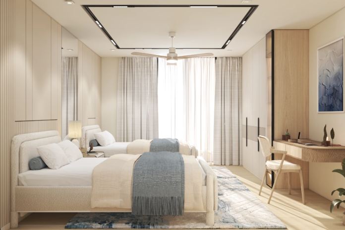 Private Villa Amalfi guest bedroom two with twin cream upholstered beds soft neutral bedding sheer curtains warm wood dresser mirrored wardrobe and integrated study desk Jumeirah Bay Island Dubai