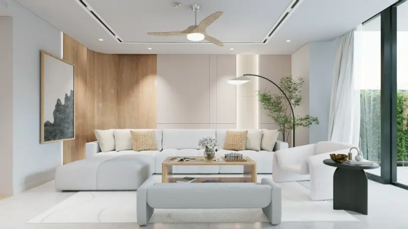 Private Villa Amalfi living area with cream L shape sectional wood accent wall sculptural boucle chairs bench ottoman and considered ceiling composition in Jumeirah Bay Island Dubai