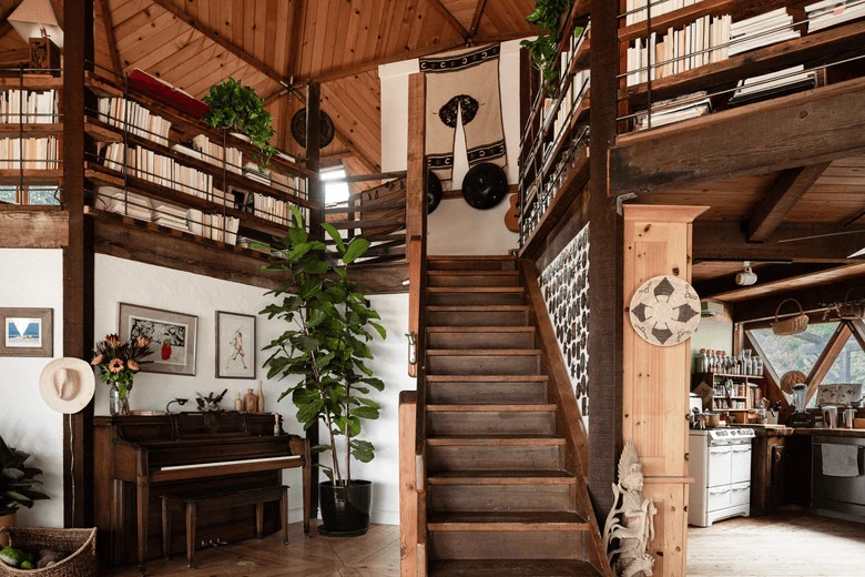 rustic farmhouse stair railing in aged timber for a relaxed home