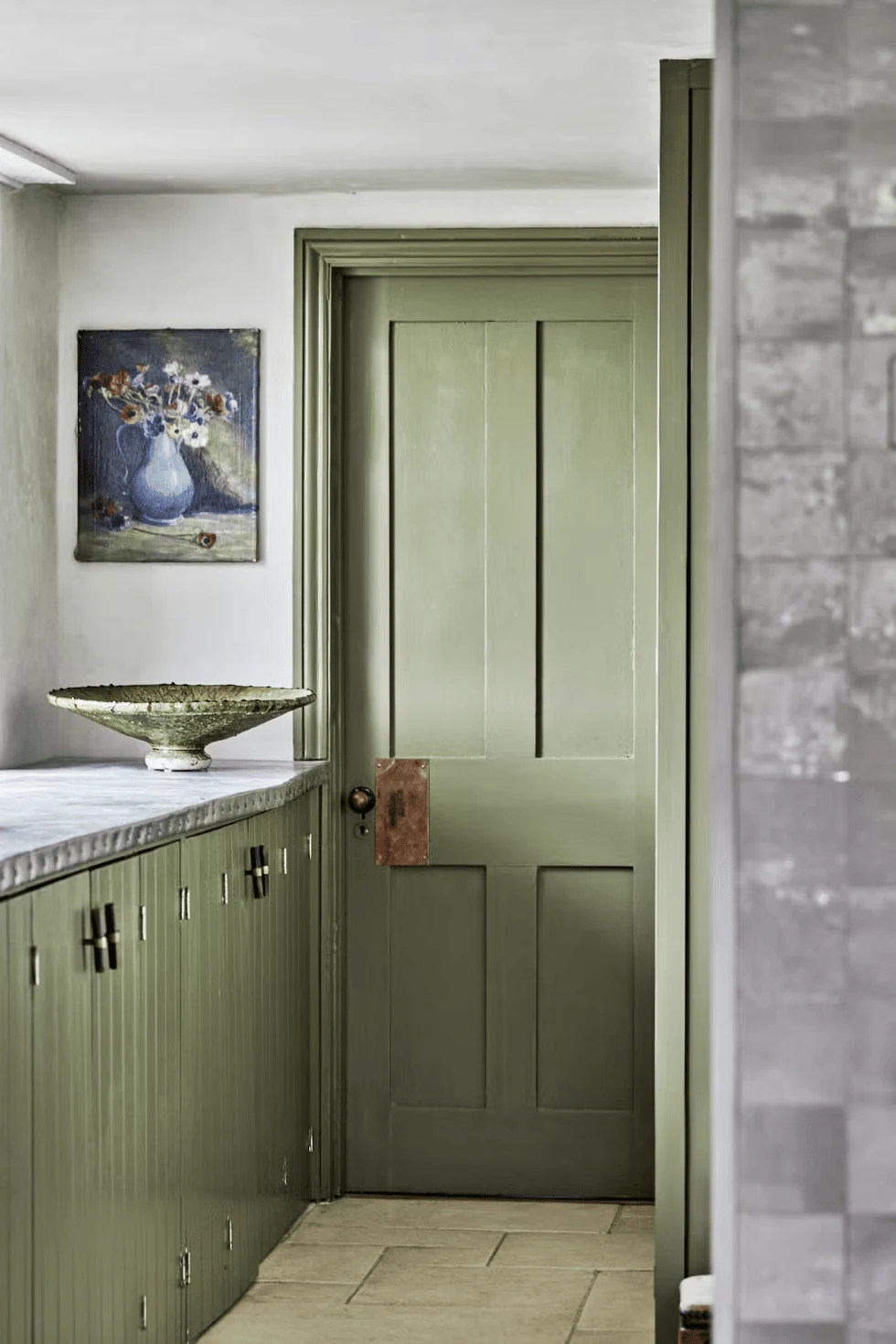 paint an interrupting kitchen door the same sage as the cabinets