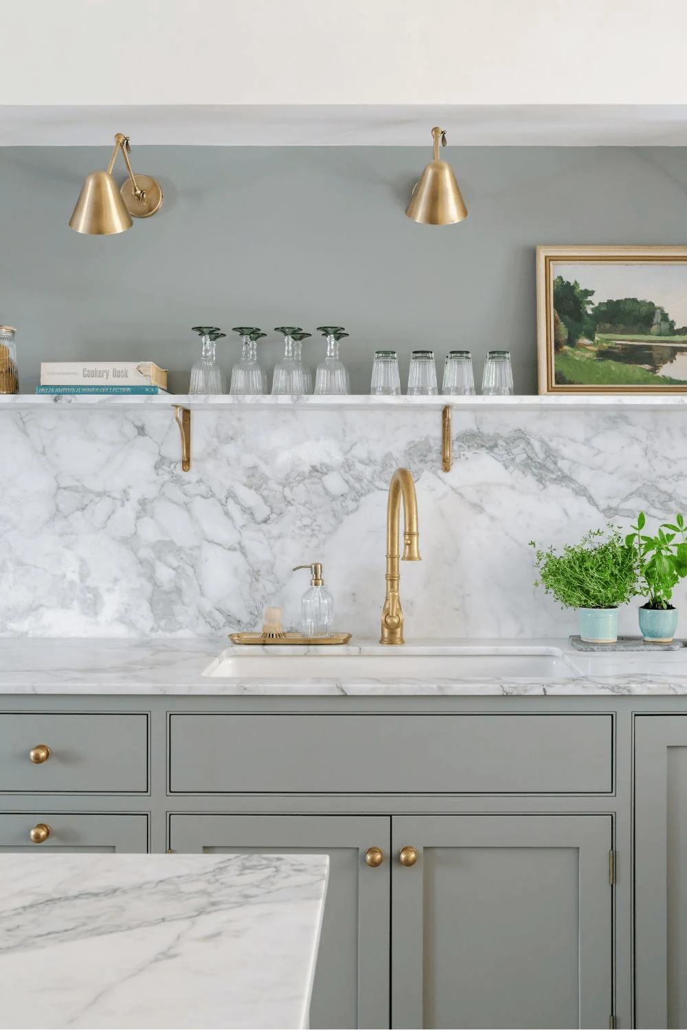 replace several wall units with one thin stone shelf sage green kitchen