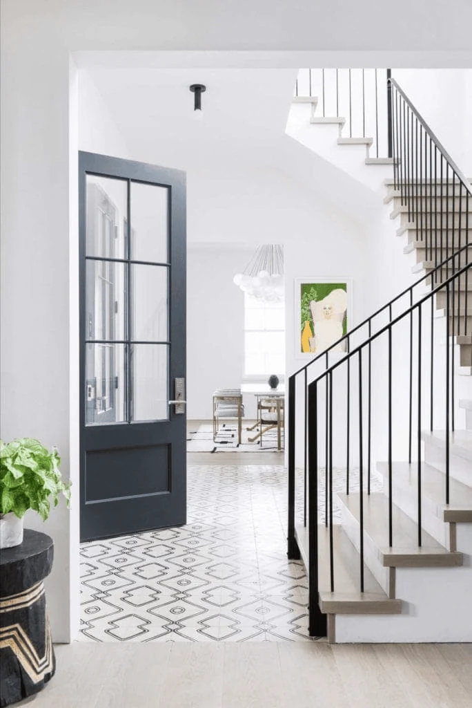 thin black stair railing giving definition without visual bulk