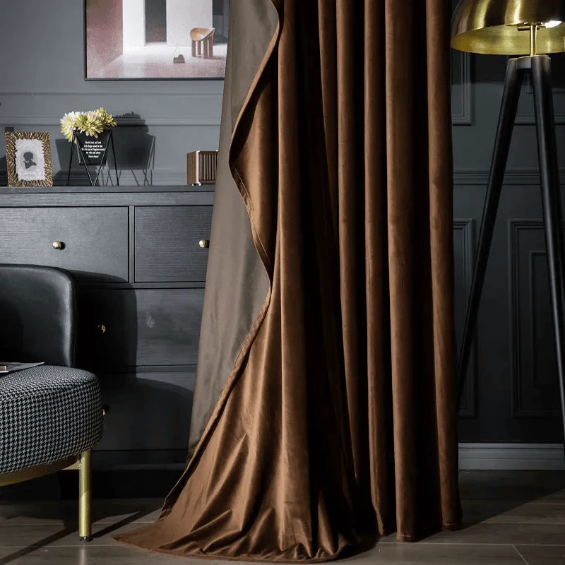 dark bedroom with puddling velvet drapery softening the room borders