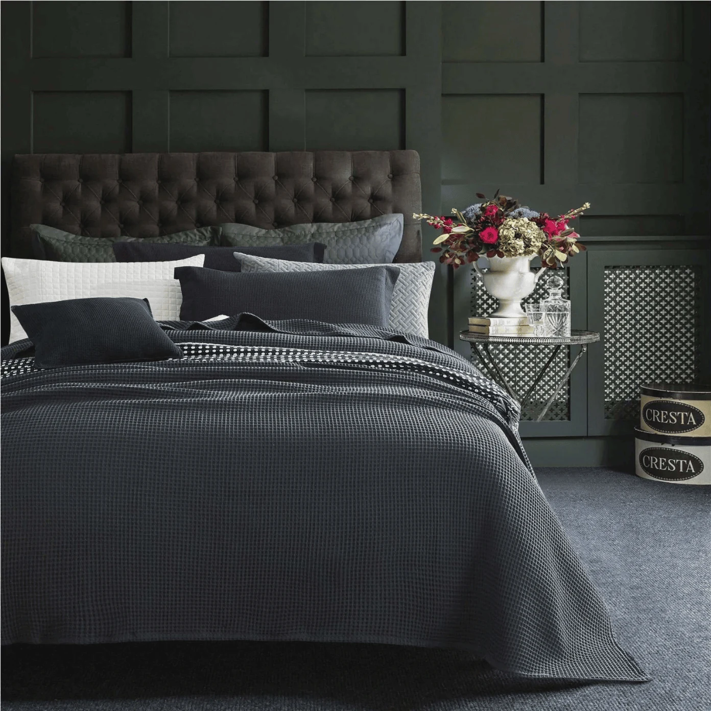 cozy dark bedroom with a waffle blanket and flax linen bedding