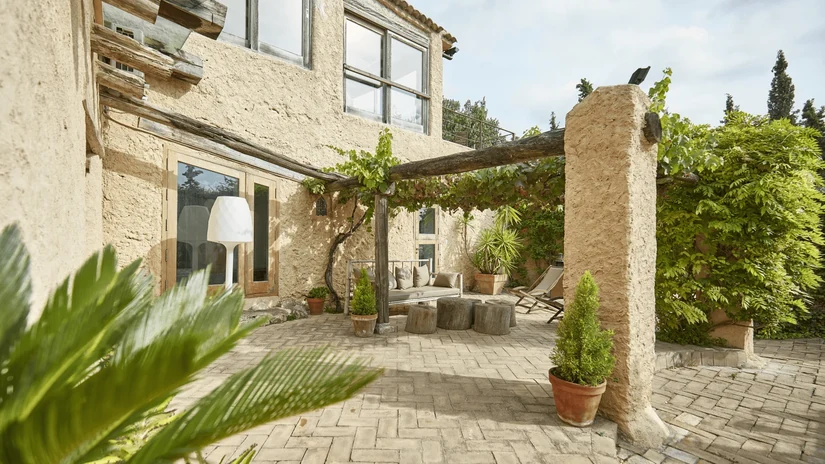rough textures and shaded pergolas for the outdoors mediterranean interior style