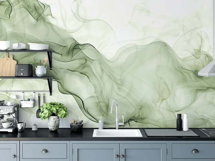 sage green watercolour kitchen wallpaper behind a grey cabinet run