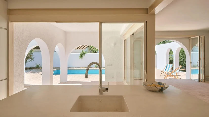 mediterranean interior style villa kitchen with arched openings to the pool